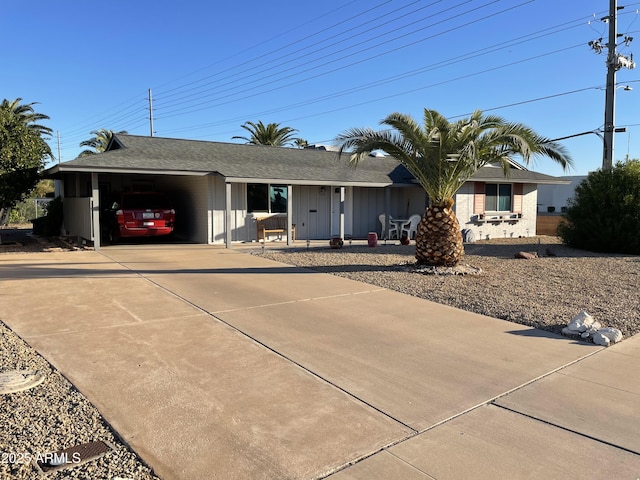 single story home featuring a carport