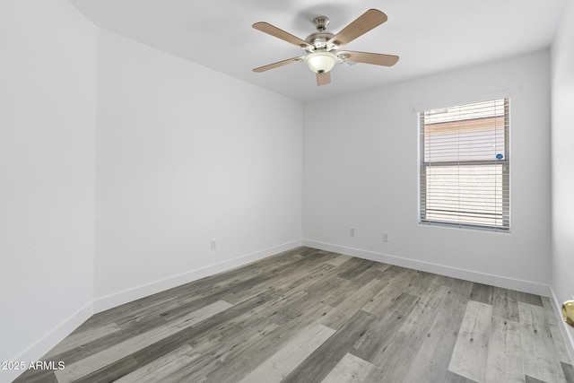 1750 E Desert Rose Trl, San Tan Valley, AZ 85143 - empty room featuring baseboards, ceiling fan, and wood finished floors