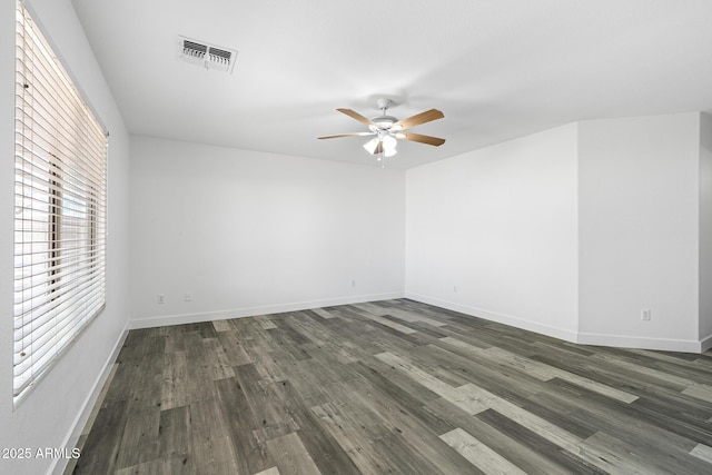 1750 E Desert Rose Trl, San Tan Valley, AZ 85143 - spare room featuring baseboards, visible vents, ceiling fan, and dark wood-style flooring