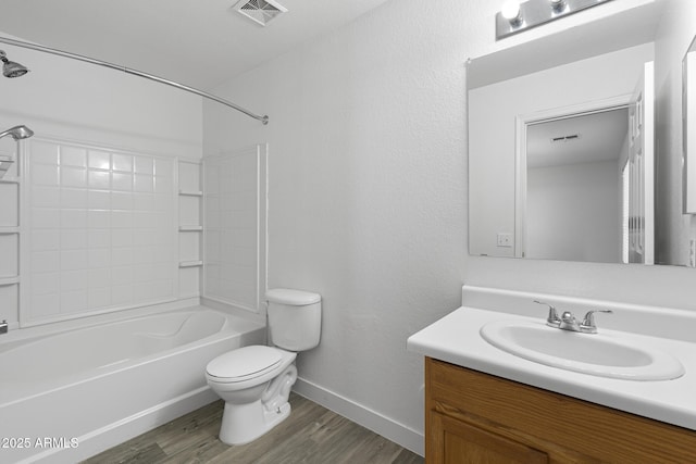1750 E Desert Rose Trl, San Tan Valley, AZ 85143 - full bathroom featuring tub / shower combination, visible vents, toilet, wood finished floors, and vanity