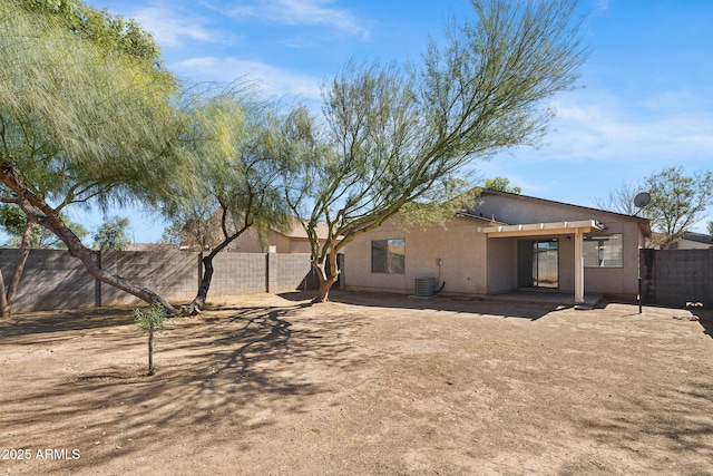 1750 E Desert Rose Trl, San Tan Valley, AZ 85143 - back of house featuring a fenced backyard, central AC, stucco siding, and a patio
