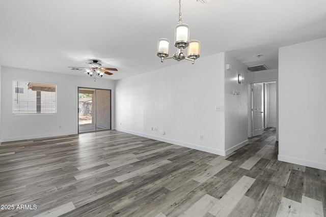 1750 E Desert Rose Trl, San Tan Valley, AZ 85143 - spare room featuring visible vents, ceiling fan with notable chandelier, baseboards, and wood finished floors