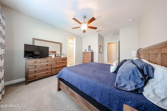 carpeted bedroom with baseboards, visible vents, and a ceiling fan