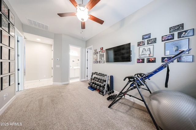 workout area with ceiling fan, carpet floors, visible vents, and baseboards