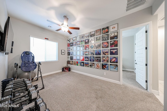 exercise room with ceiling fan, carpet floors, visible vents, and baseboards