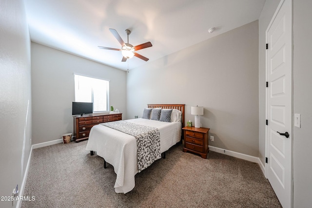 bedroom with a ceiling fan, carpet flooring, and baseboards