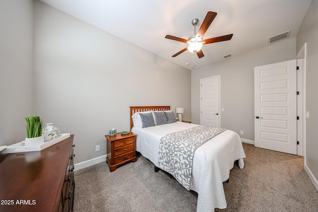 carpeted bedroom featuring a ceiling fan, lofted ceiling, visible vents, and baseboards