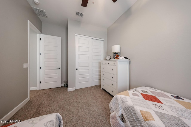 bedroom featuring baseboards, a closet, visible vents, and carpet flooring