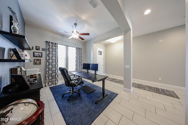 office area with visible vents, ceiling fan, baseboards, and light tile patterned floors