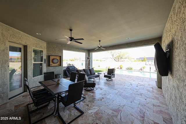 view of patio featuring a fenced in pool, area for grilling, an outdoor hangout area, a ceiling fan, and fence