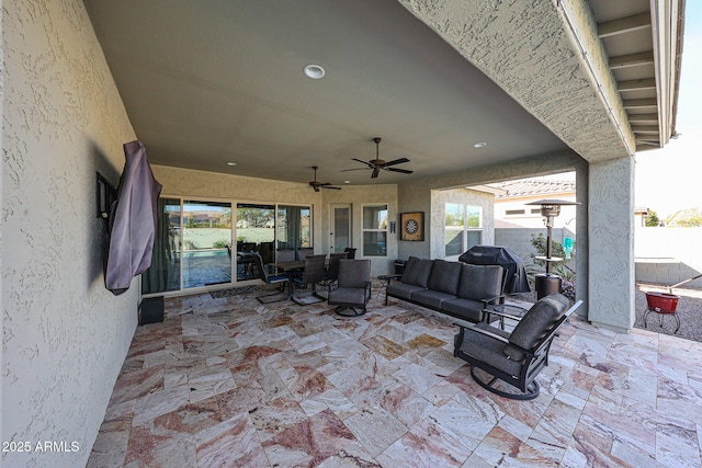 view of patio featuring ceiling fan, grilling area, an outdoor hangout area, and fence