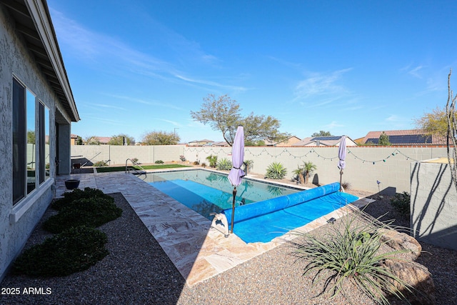 view of pool with a fenced backyard, a fenced in pool, and a patio