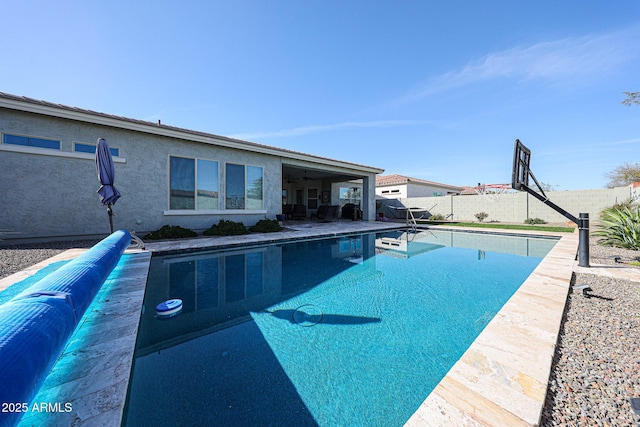 view of swimming pool featuring a fenced backyard, a fenced in pool, and a patio