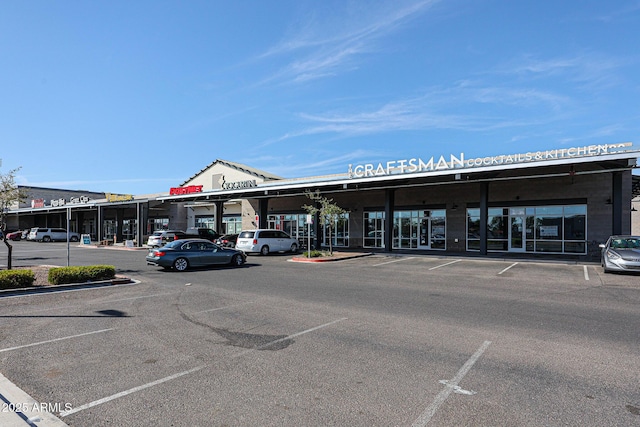 view of property with uncovered parking