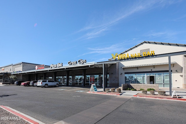 view of property with uncovered parking