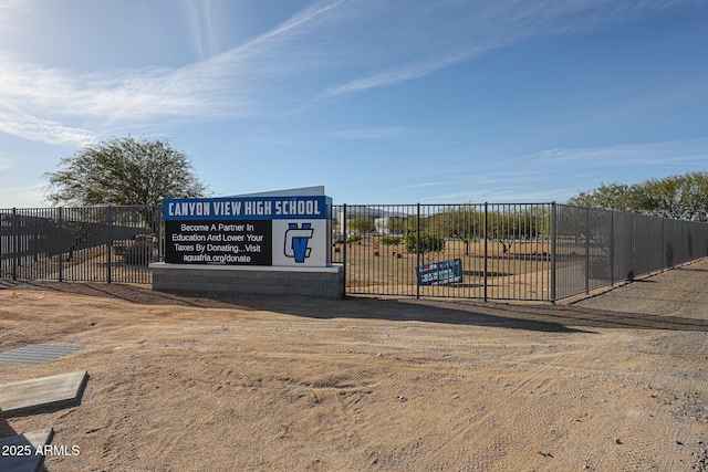 view of home's community featuring fence