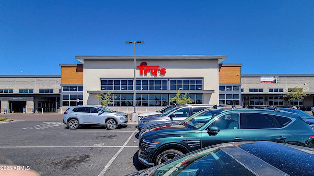 view of property featuring uncovered parking