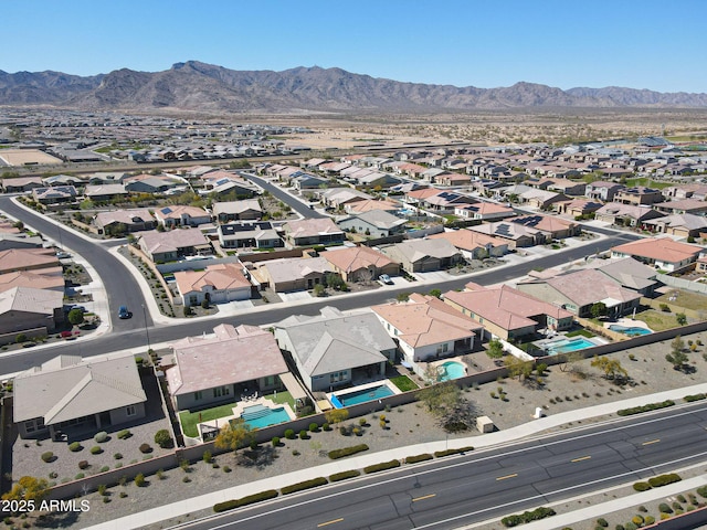birds eye view of property with a residential view and a mountain view