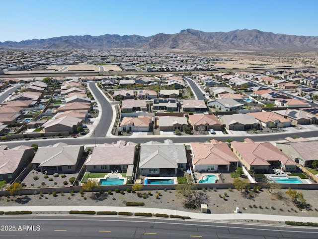drone / aerial view featuring a residential view and a mountain view
