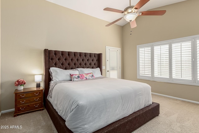 carpeted bedroom featuring vaulted ceiling and ceiling fan