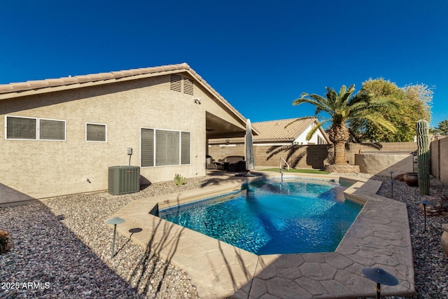 view of swimming pool featuring central AC unit and a patio area