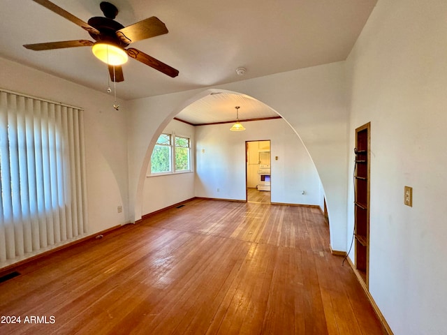 unfurnished room with light hardwood / wood-style flooring and ceiling fan