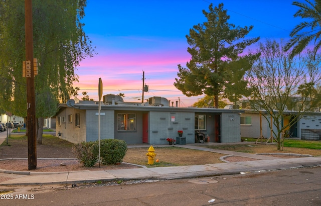 view of front of property with central AC unit