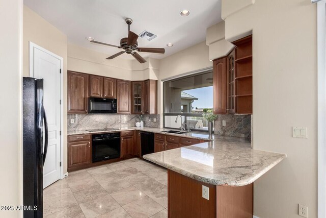 16540 E El Lago Blvd Unit 2, Fountain Hills, AZ 85268 - kitchen featuring black appliances, a peninsula, a sink, a ceiling fan, and tasteful backsplash