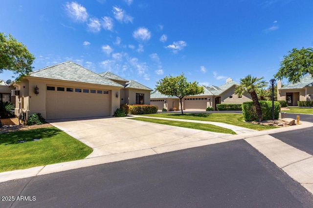 16540 E El Lago Blvd Unit 2, Fountain Hills, AZ 85268 - single story home featuring a garage, stucco siding, concrete driveway, and a front yard