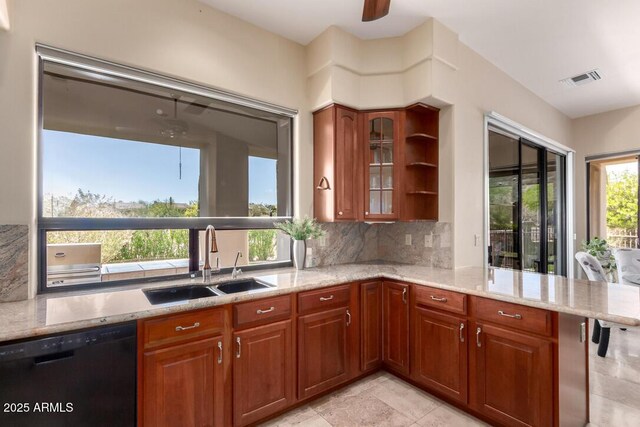 16540 E El Lago Blvd Unit 2, Fountain Hills, AZ 85268 - kitchen with black dishwasher, a sink, healthy amount of natural light, and light stone countertops