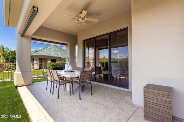 16540 E El Lago Blvd Unit 2, Fountain Hills, AZ 85268 - view of patio featuring ceiling fan, outdoor dining space, and fence