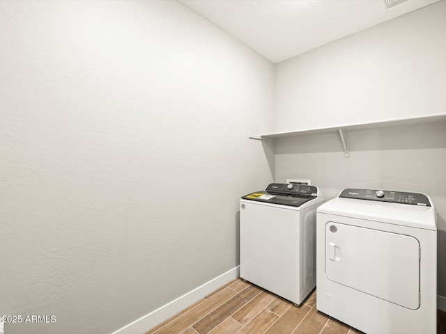 washroom featuring washer and dryer