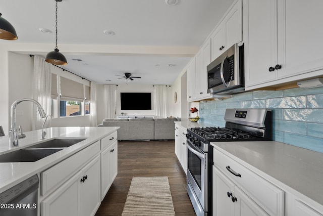 1800 S Jesse Pl, Chandler, AZ 85286 - kitchen featuring appliances with stainless steel finishes, backsplash, light countertops, and white cabinets