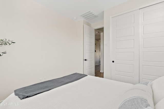 1800 S Jesse Pl, Chandler, AZ 85286 - bedroom with a closet and dark wood-type flooring