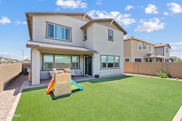 1800 S Jesse Pl, Chandler, AZ 85286 - back of property featuring a fenced backyard, a patio, and stucco siding