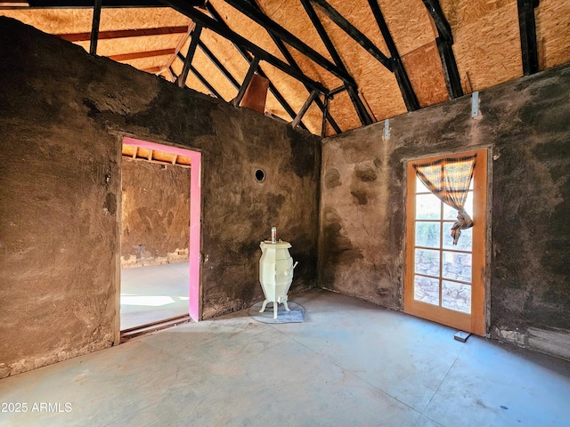 83 Ok St, Bisbee, AZ 85603 - unfurnished room featuring concrete floors and high vaulted ceiling
