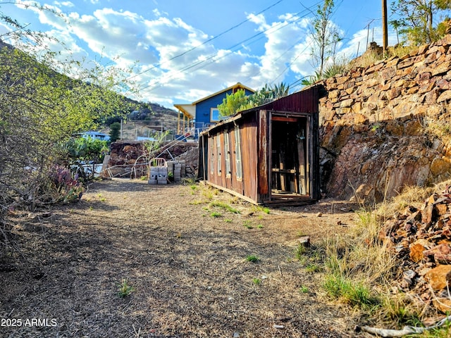 83 Ok St, Bisbee, AZ 85603 - view of yard featuring a shed