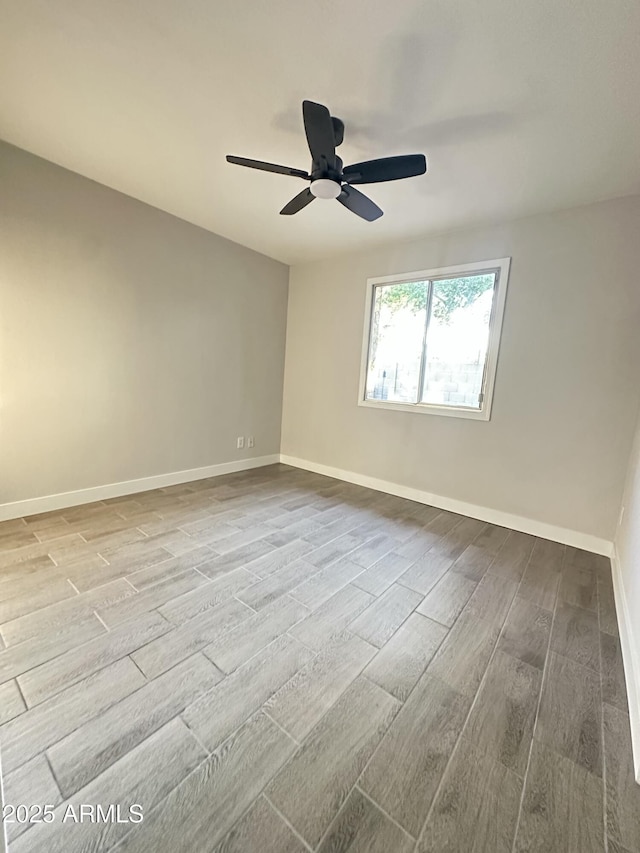4902 S Fair Ln, Tempe, AZ 85282 - spare room featuring wood finished floors, baseboards, and a ceiling fan