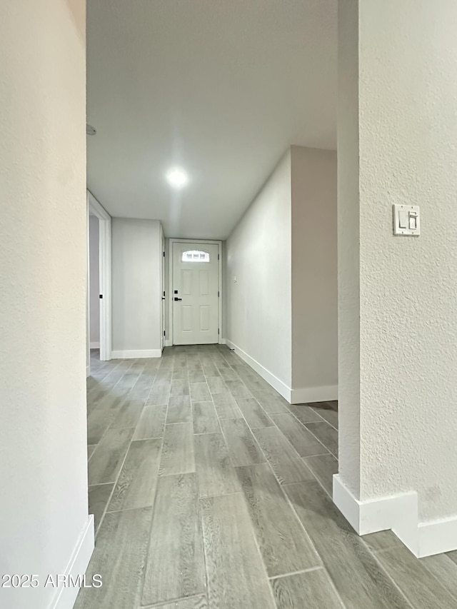 4902 S Fair Ln, Tempe, AZ 85282 - foyer with wood finished floors, baseboards, and a textured wall