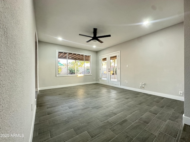 4902 S Fair Ln, Tempe, AZ 85282 - unfurnished room with ceiling fan, wood finish floors, baseboards, a textured wall, and french doors