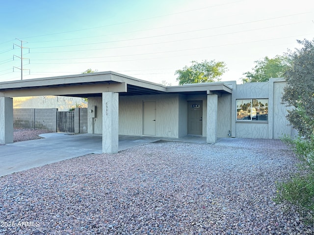4902 S Fair Ln, Tempe, AZ 85282 - garage featuring concrete driveway and a carport