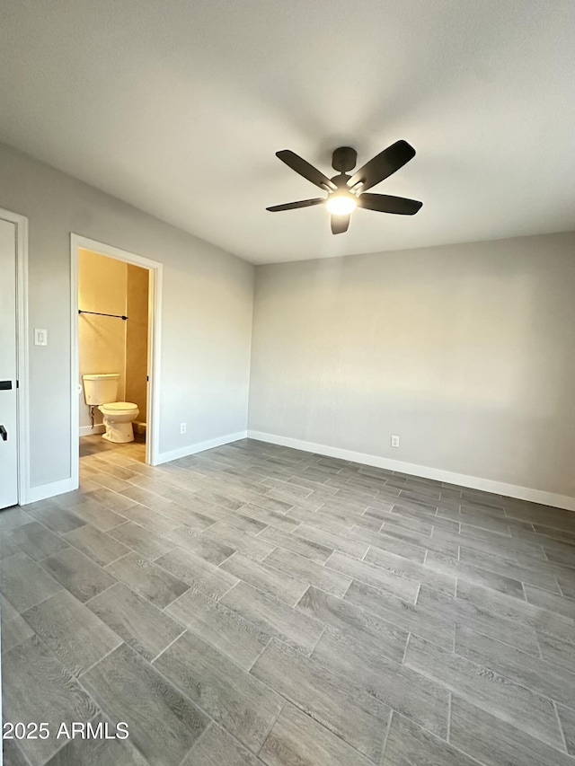 4902 S Fair Ln, Tempe, AZ 85282 - unfurnished bedroom with connected bathroom, baseboards, and a ceiling fan