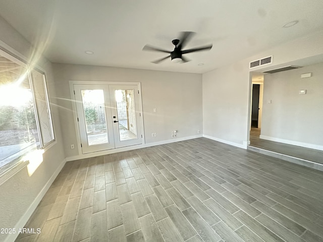 4902 S Fair Ln, Tempe, AZ 85282 - unfurnished room featuring ceiling fan, french doors, baseboards, and wood finished floors