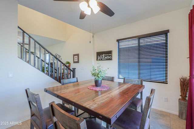 dining area with ceiling fan and light tile patterned floors