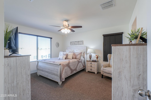 bedroom featuring dark colored carpet and ceiling fan