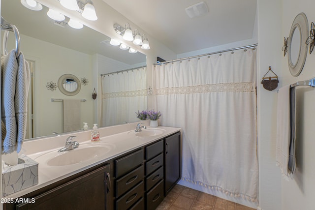 bathroom featuring vanity and a shower with curtain