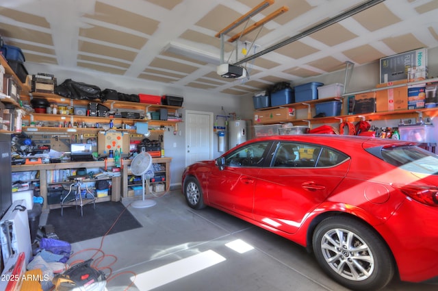 garage with a workshop area, electric water heater, and a garage door opener