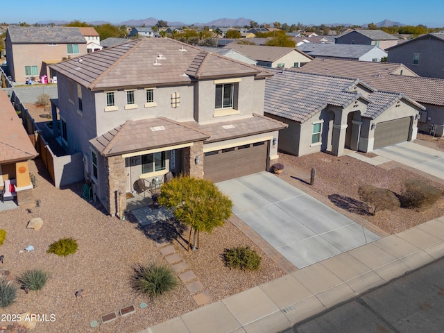 view of front of property featuring a garage and a mountain view