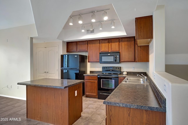 280 S Evergreen Rd Unit 1296, Tempe, AZ 85288 - kitchen featuring black appliances, dark countertops, a kitchen island, and brown cabinetry