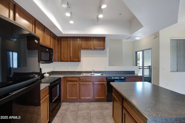 280 S Evergreen Rd Unit 1296, Tempe, AZ 85288 - kitchen with black appliances, dark countertops, a raised ceiling, and light tile patterned flooring